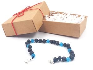 Adjustable unpolished black amber bracelet with blue cats eye